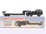 a toy truck with a trailer attached to it ' s back