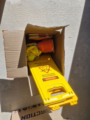 a cardboard box with a bunch of items inside of it