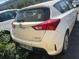 a white car parked in a parking lot next to other cars