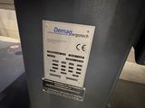 a sign on the side of a machine that says demming