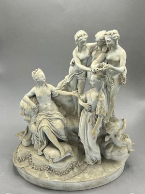an image of a statue of a group of women on a rock