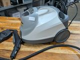 a vacuum that is sitting on a wooden table