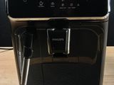 the coffee machine is sitting on the table ready to be used