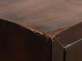 a close up of a wooden table with a brown top
