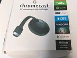 a box of chromecast sitting on a table next to a mouse