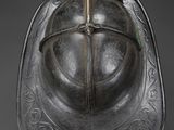 a silver helmet with a cross on the front of it
