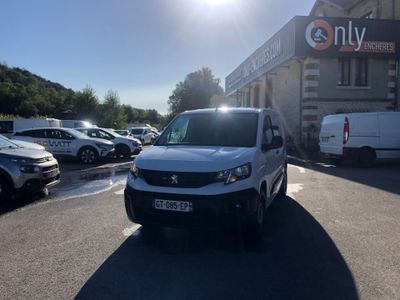 a white van that is parked in a parking lot