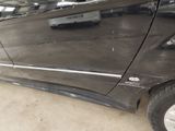 a picture of a car that has been dented and is in a garage