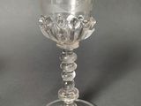 a glass cup that is sitting on a table