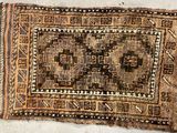 a close up of a rug on a floor with a white background