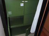 a green filing cabinet with a box on top of it