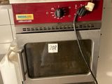 an image of a kitchen with a microwave and a basket of eggs