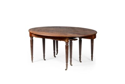 une table à manger ovale à deux pieds, avec un plateau en bois