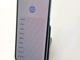a close up of a cell phone sitting on top of a table