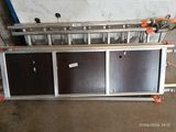 a metal rack with two doors on it in a garage