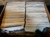 a lot of old records in a box on the table