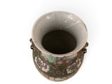 a white vase with a floral design on it