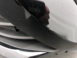 a close up of a person ' s hand on the front of a car