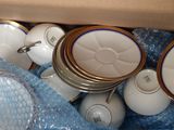 a lot of cups and saucers in a box