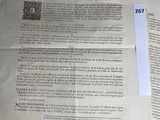 a piece of paper that is laying on top of a pile of papers