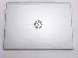 a laptop that is sitting on a white table
