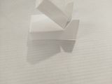 a small piece of paper that is on top of a bed