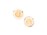 a pair of earrings with white flowers on a white background