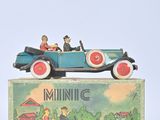 a toy car with two people in it sitting on top of a box