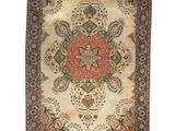 an antique rug with a floral design on a white background