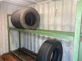 two tires sitting on a shelf in a room