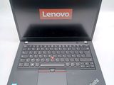 a laptop with a lenovo logo on the screen