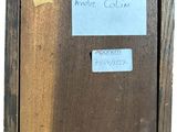 an old picture of a wooden frame with a sticker attached to it