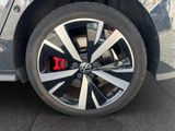 a close up of a car ' s wheel with a red sticker on it