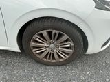 a white car that is parked in a parking lot