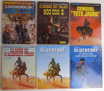 Six livres de la série « Blueberry Western » sont alignés sur une table