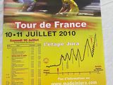 a poster with a picture of a man riding a bike