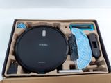 a box with a vacuum cleaner and other items in it
