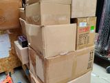 a pile of cardboard boxes sitting on top of a pallet