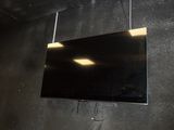 a flat screen tv hanging on the wall in the room