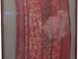 framed picture of a piece of cloth with a pattern on it