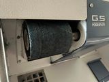 a toilet paper dispenser with a roll of toilet paper in it