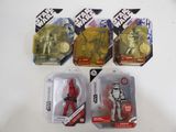 five star wars action figures are on display on a table