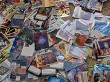 a pile of cards on the floor next to a box