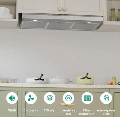 a picture of a kitchen with a range hood above the stove