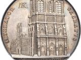 an image of a silver coin with a picture of a cathedral on it