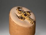 gold and amethorate cross brooch with amethorate beads
