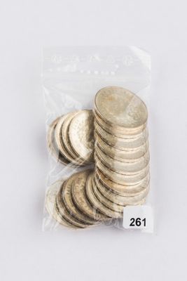 a bag of coins sitting on top of a table