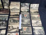 several old postcards of different types and sizes on a table