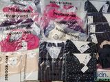 many different types of clothing on display in the store