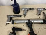 a lot of tools that are laying out on a table